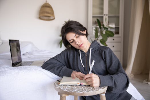 person journaling in a cozy space