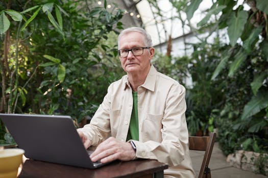 a quiet workspace with plants and a laptop