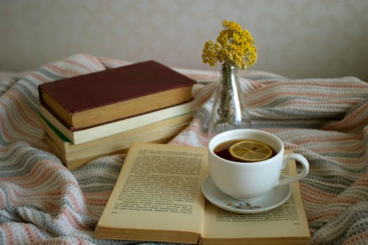 a cozy reading nook with books and tea